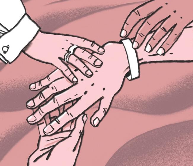 A family placing hands on top of each other
