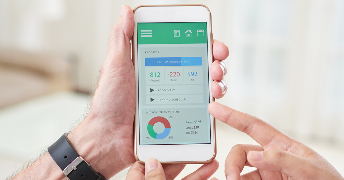 two people looking at a health care management app on a smartphone