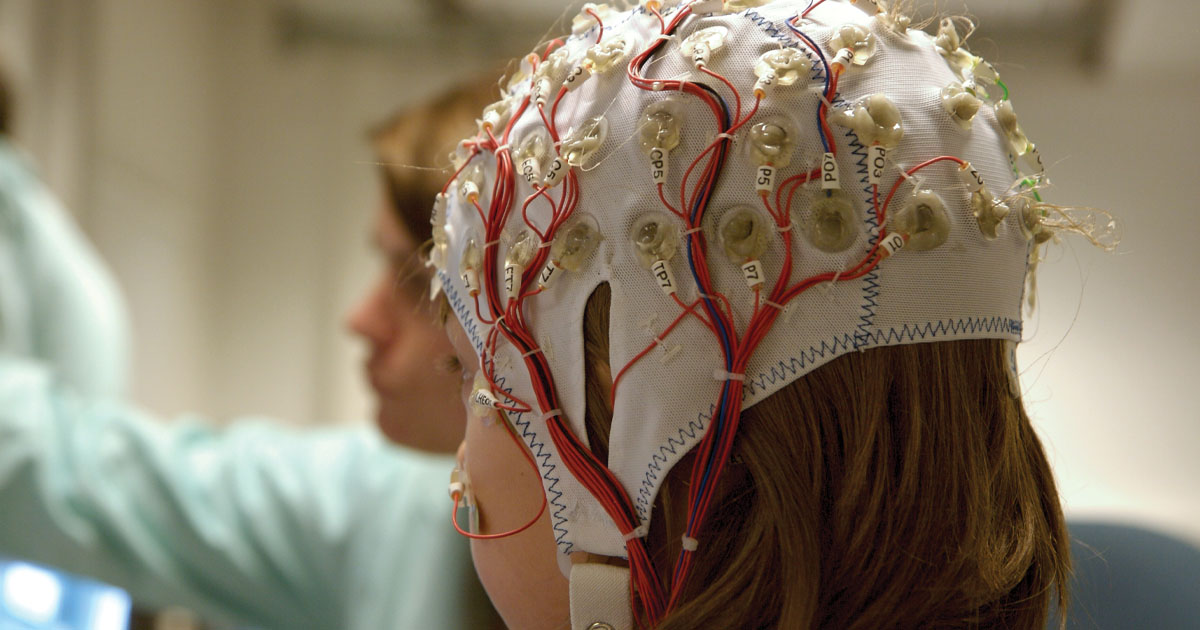Person wearing an EEG cap during brain activity testing