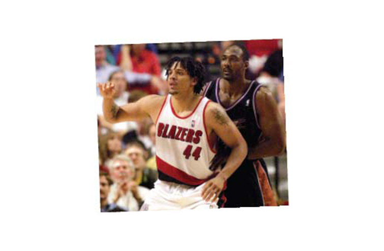 Brian Grant as a Portland Trail Blazer, competing against Karl Malone, in 1999.