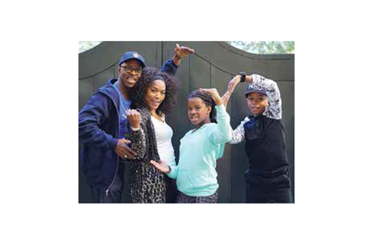 Courtney B. Vance with his wife and two children. 