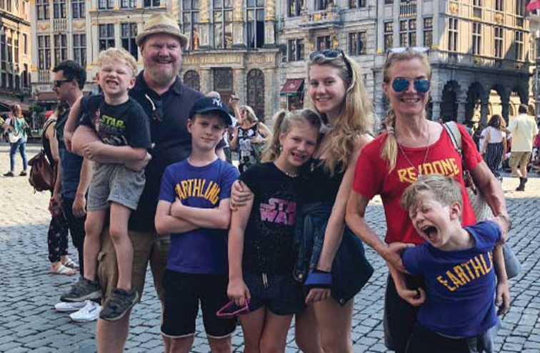 Jim and Jeannie Gaffigan with their five children on the streets of Brussels.