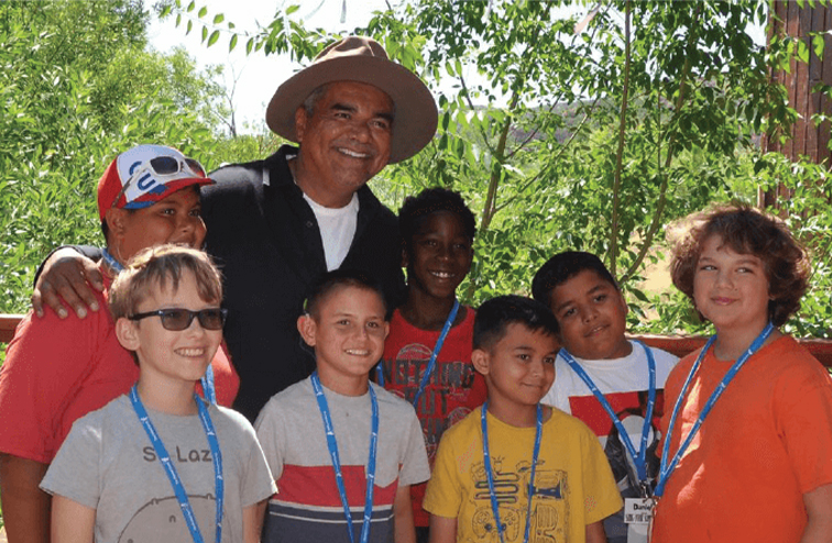 George Lopez poses for a picture with seven youngsters who attended his "Kidney Camp" for children with serious illnesses.