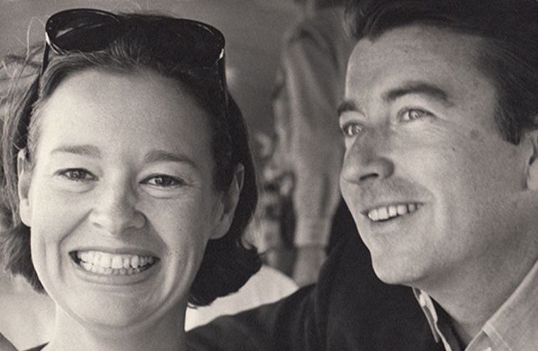 A black and white photo of Cooper's smiling parents, Gloria Vanderbilt and Wyatt Cooper, in 1963