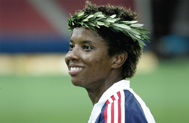 Scurry wearing a a laurel wreath, on the field for the Olympics in Athens in 2004. 