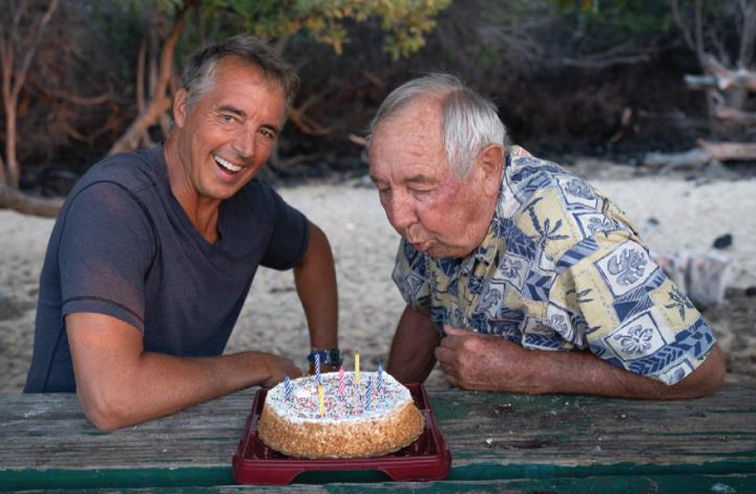 Dan Buettner and his father, Roger, celebrate Roger's 88th birthday