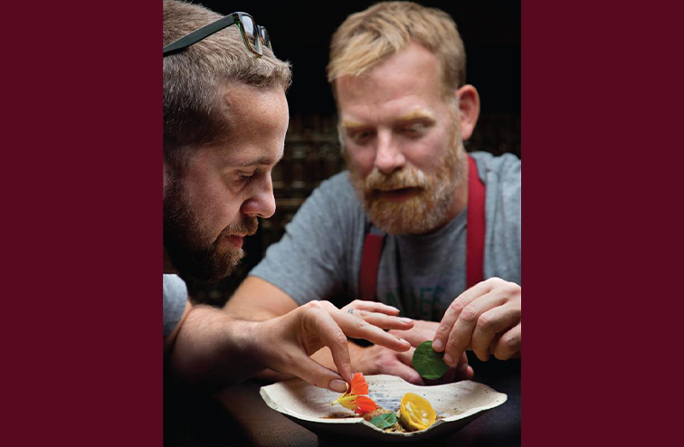 Dan Jacobs and Van Rite plating food at DanDan, the restaurant they co-own in Milwaukee.