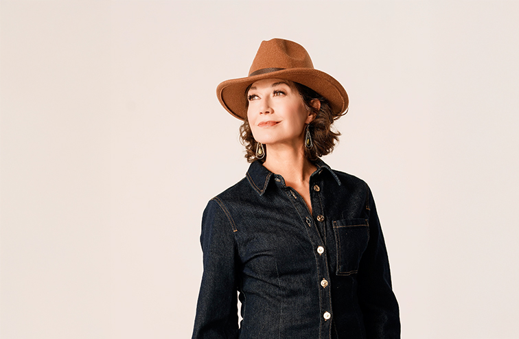 Singer Amy Grant in a denim shirt and cowboy hat