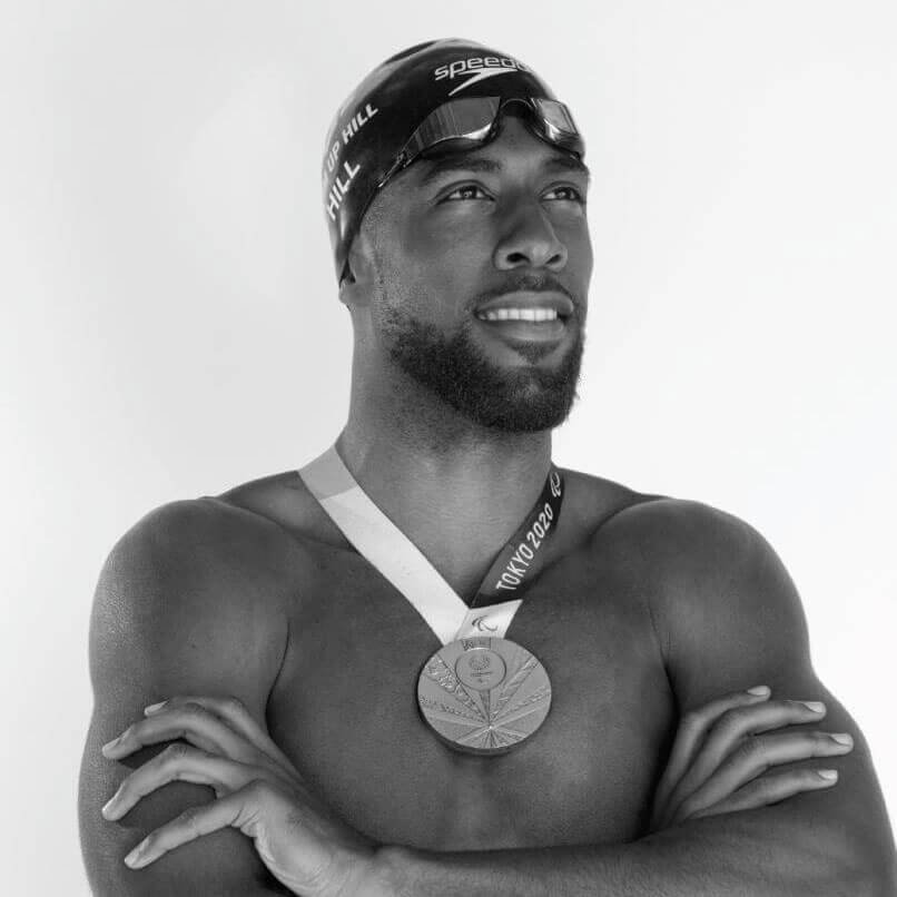 Jamal Hill posing with his bronze medal