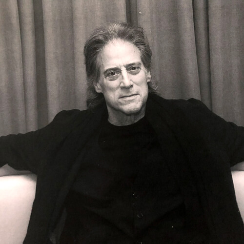 A black and white photo of comedian and Parkinson's advocate, Richard Lewis