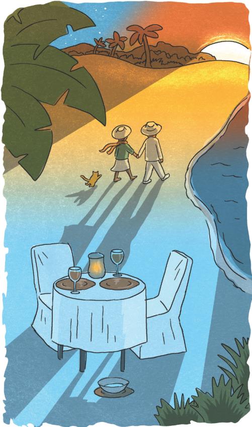 Couple walking along the beach holding hands while the sun sets